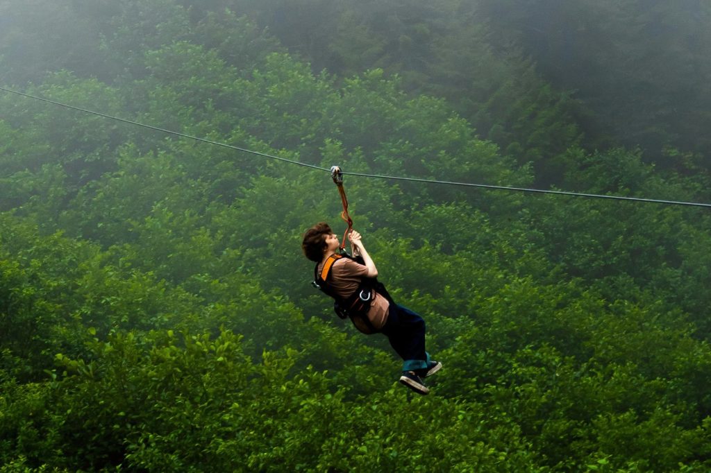 ZIP LINE - Experience the ultimate adrenaline rush as you soar through the air in one thrilling motion.